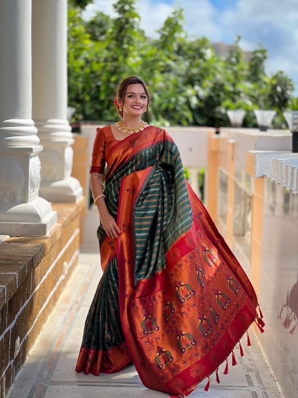 Adorned with beautiful Zari work Saree From Soti Designer