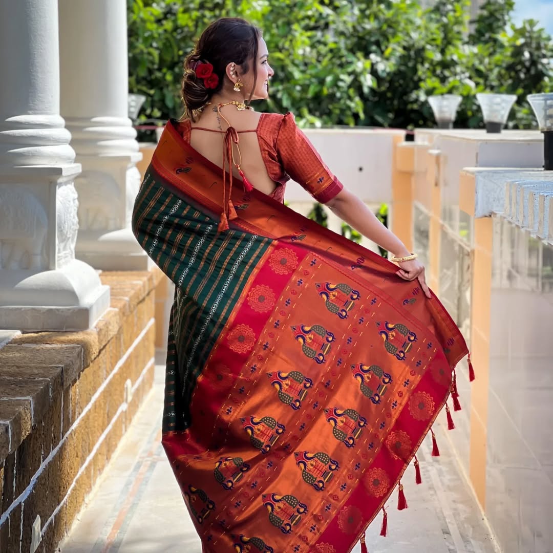 Adorned with beautiful Zari work Saree From Soti Designer